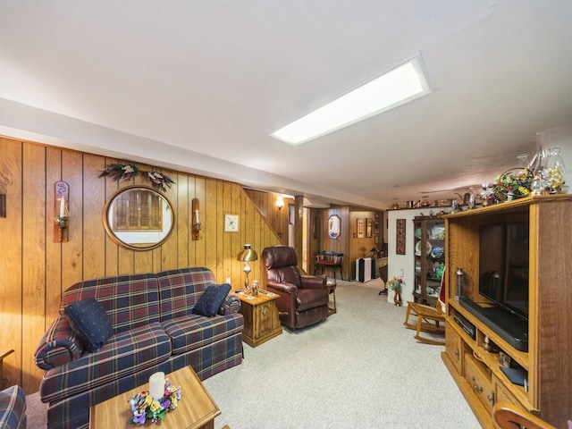 living area with wooden walls and carpet floors