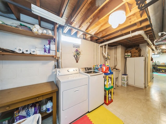 washroom featuring washing machine and dryer and laundry area