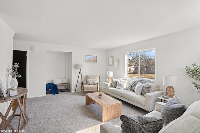 living room with baseboards and carpet floors