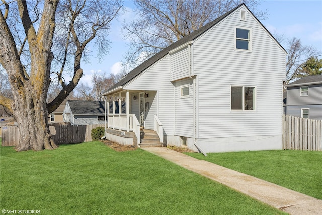 exterior space with a front lawn and fence