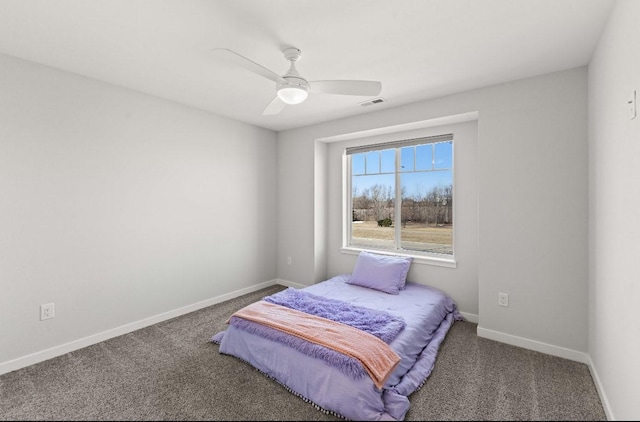 carpeted bedroom with visible vents, baseboards, and ceiling fan