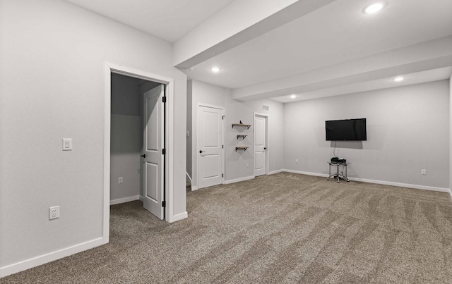 below grade area featuring visible vents, carpet flooring, recessed lighting, and baseboards