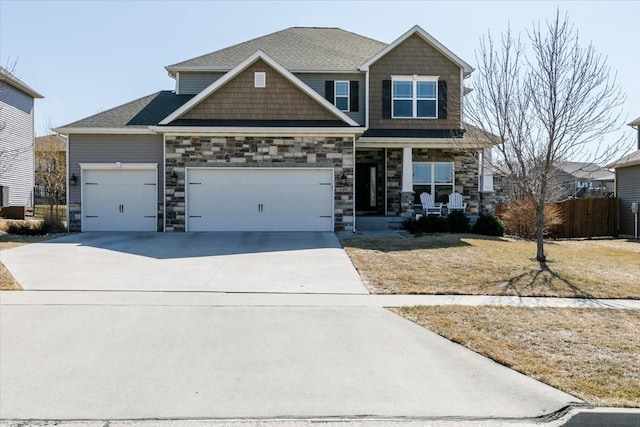 craftsman-style home featuring fence, a porch, concrete driveway, stone siding, and an attached garage