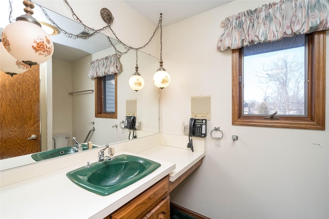 bathroom featuring toilet and vanity