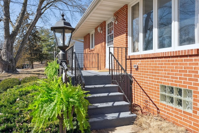 property entrance with brick siding