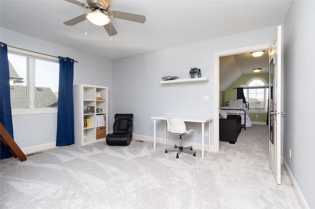 carpeted office with visible vents, ceiling fan, and baseboards