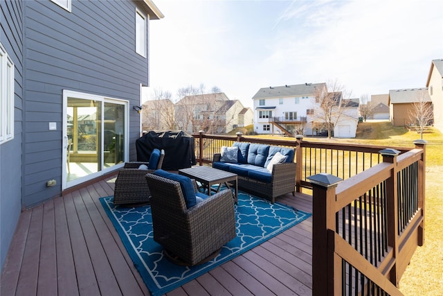 wooden terrace featuring grilling area, a residential view, and an outdoor hangout area