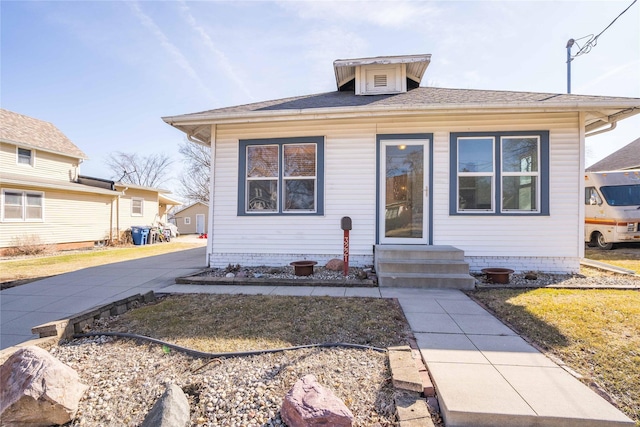 bungalow-style house featuring entry steps