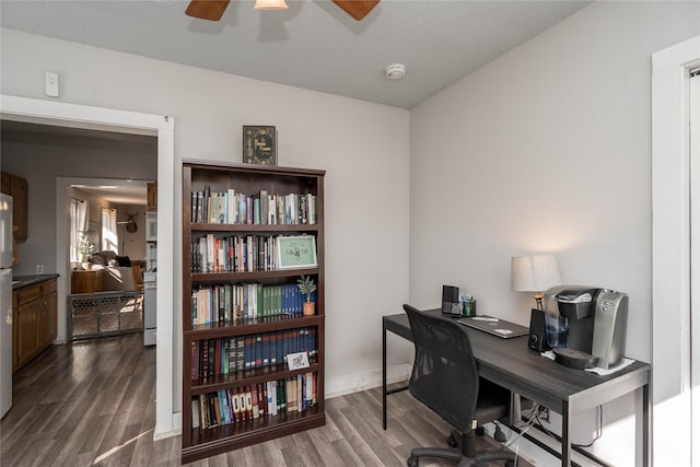 office featuring dark wood-style flooring and ceiling fan