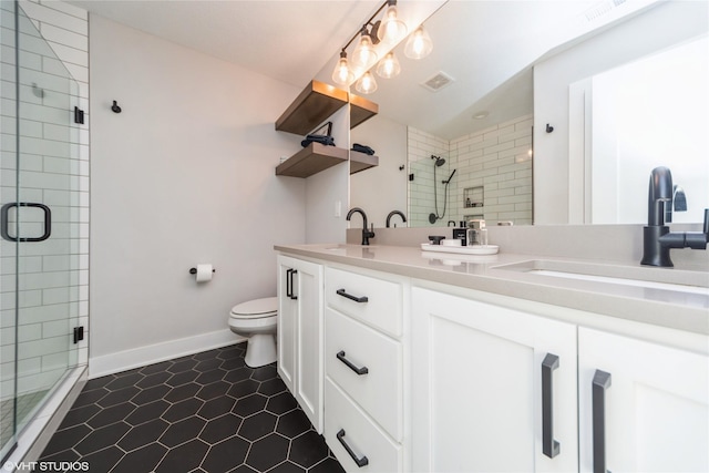 full bath featuring visible vents, a shower stall, toilet, and a sink