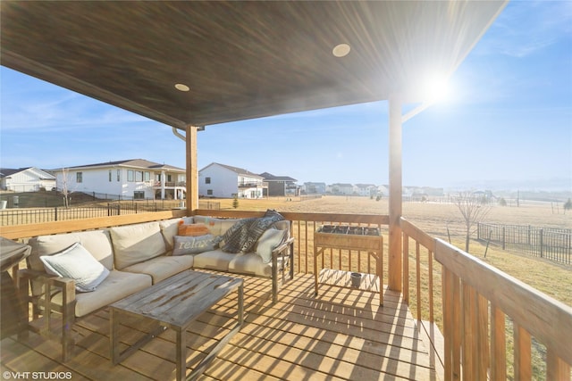 deck featuring a residential view, outdoor lounge area, and fence