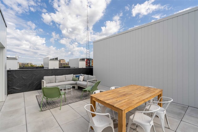 1201 Center St Unit F103, Des Moines, IA 50309 - view of patio with an outdoor hangout area and outdoor dining area