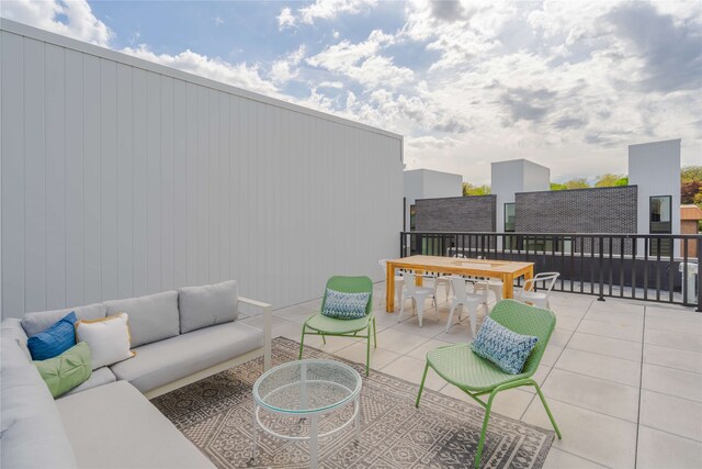 1201 Center St Unit F103, Des Moines, IA 50309 - view of patio / terrace featuring outdoor lounge area and outdoor dining area