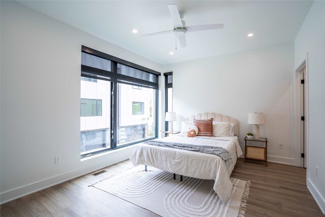 1201 Center St Unit F103, Des Moines, IA 50309 - bedroom featuring wood finished floors, baseboards, recessed lighting, and ceiling fan