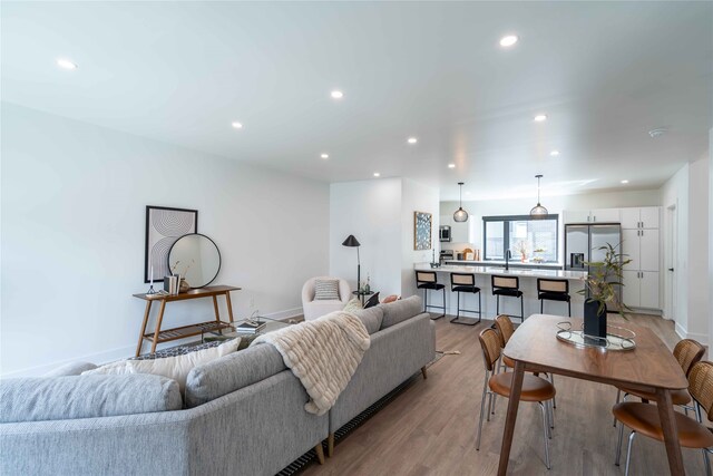 1201 Center St Unit F103, Des Moines, IA 50309 - living area featuring recessed lighting, light wood-style flooring, and baseboards