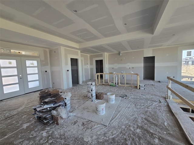 empty room with a healthy amount of sunlight and french doors