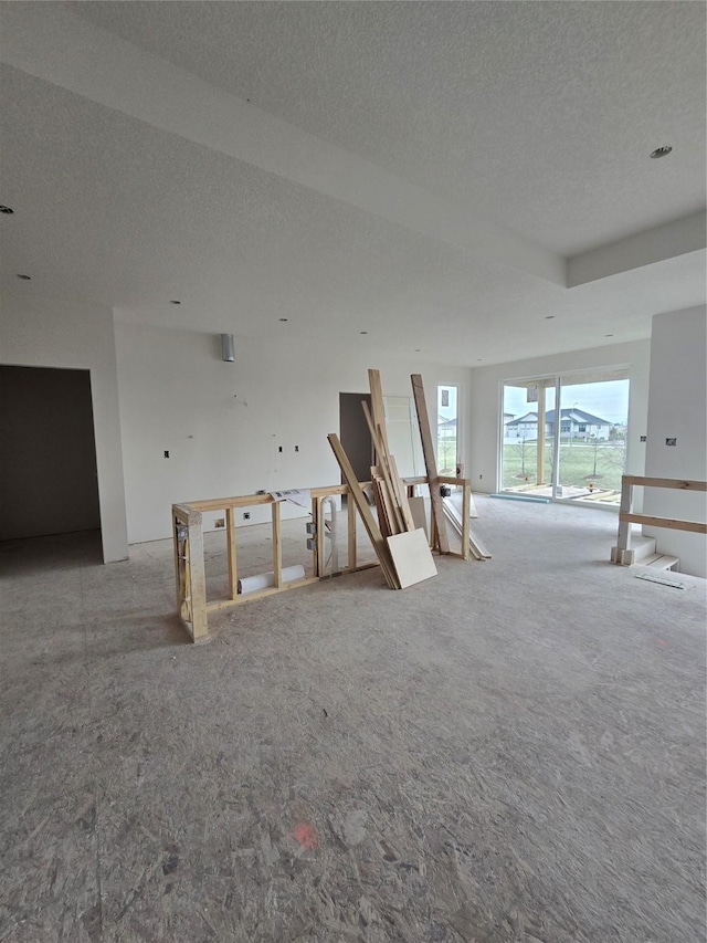 interior space with carpet and a textured ceiling