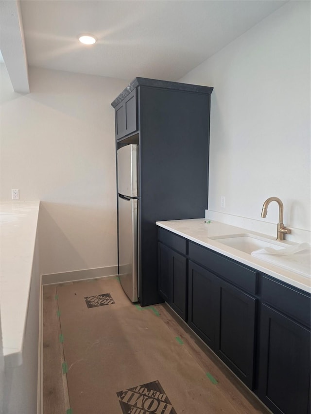 16203 Goodman Dr, Urbandale, IA 50323 - kitchen featuring freestanding refrigerator and light countertops