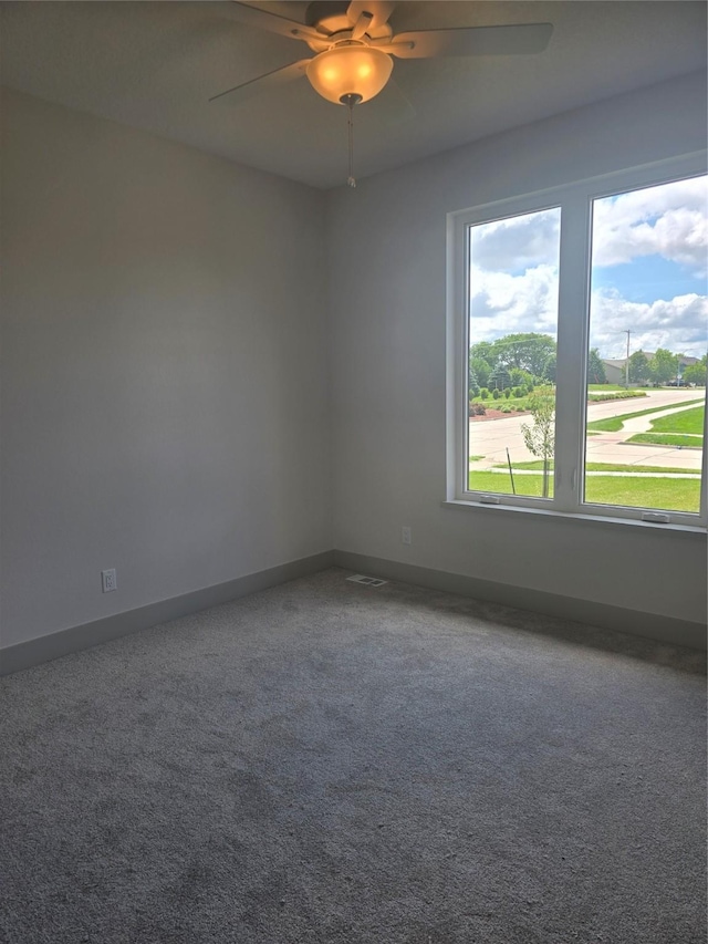 16203 Goodman Dr, Urbandale, IA 50323 - carpeted empty room with a ceiling fan and baseboards