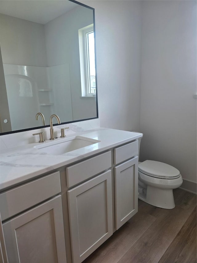 16203 Goodman Dr, Urbandale, IA 50323 - bathroom featuring vanity and wood finished floors