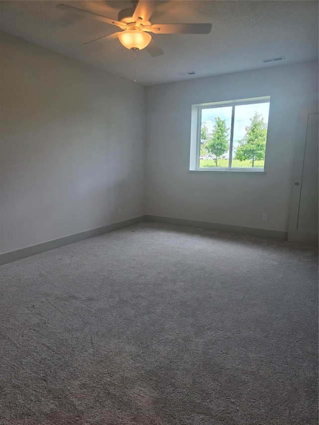 16203 Goodman Dr, Urbandale, IA 50323 - carpeted empty room featuring a ceiling fan and baseboards