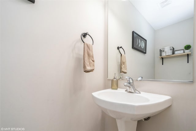 bathroom with a sink and visible vents