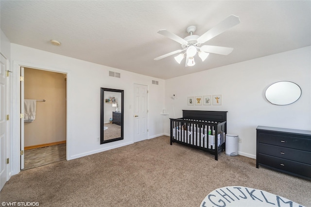 bedroom featuring baseboards, visible vents, carpet floors, and ceiling fan