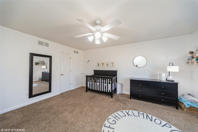 bedroom featuring visible vents, carpet floors, baseboards, and ceiling fan