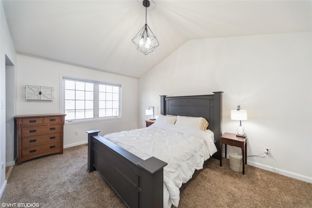 bedroom with baseboards, carpet, and vaulted ceiling