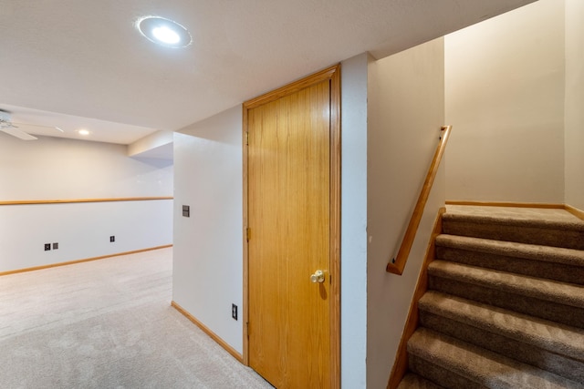 staircase featuring recessed lighting, a ceiling fan, baseboards, and carpet floors