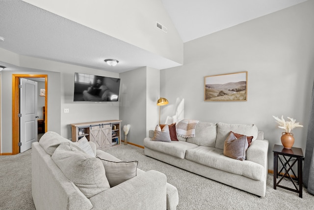 living area with visible vents, baseboards, carpet, and vaulted ceiling