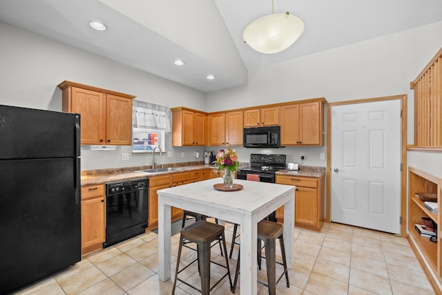 kitchen with black appliances, light tile patterned flooring, recessed lighting, and a sink