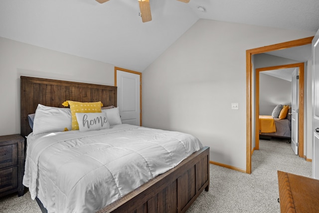 bedroom with baseboards, light colored carpet, a ceiling fan, and vaulted ceiling