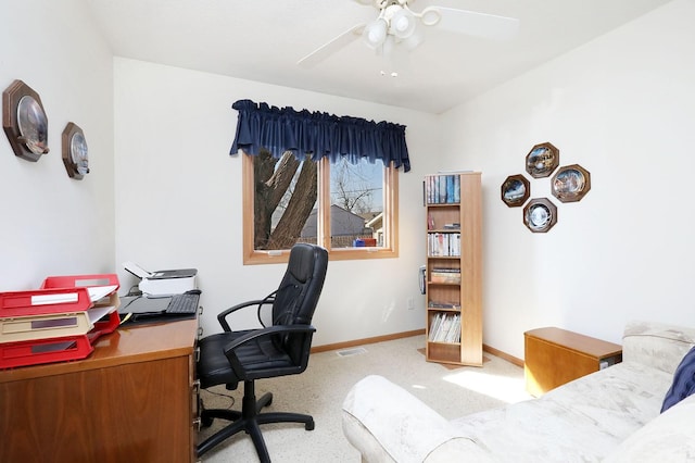 office featuring visible vents, baseboards, carpet floors, and ceiling fan