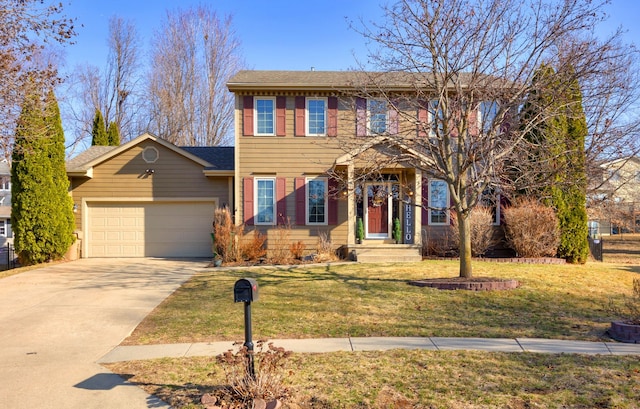 colonial-style house with a garage, concrete driveway, a front yard, and a shingled roof