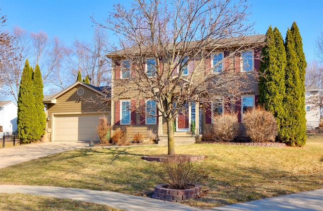 view of front of house featuring a front lawn, a garage, and driveway