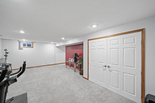 workout area featuring recessed lighting, baseboards, and carpet floors