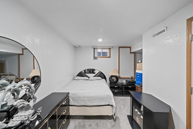 carpeted bedroom with visible vents