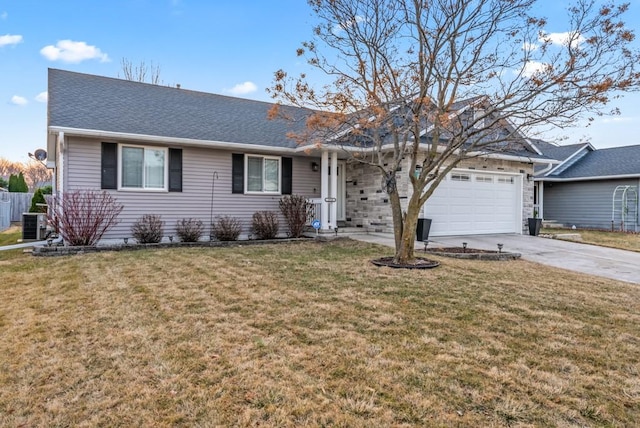 ranch-style home featuring a front lawn, an attached garage, driveway, and a shingled roof