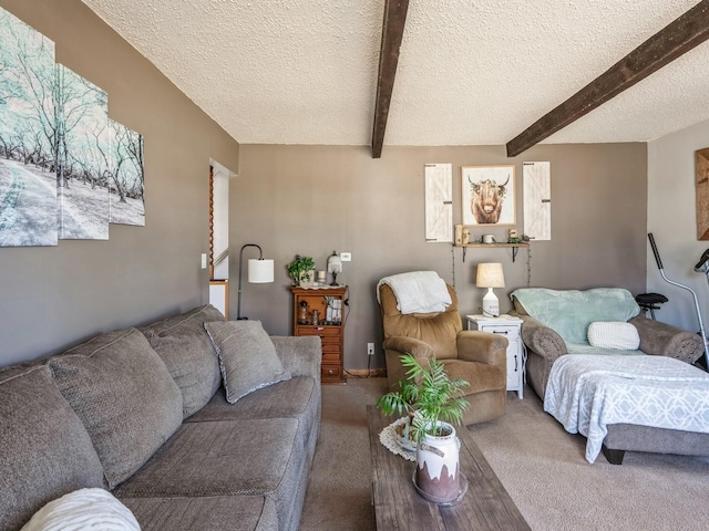 living room featuring beam ceiling, a textured ceiling, and carpet flooring