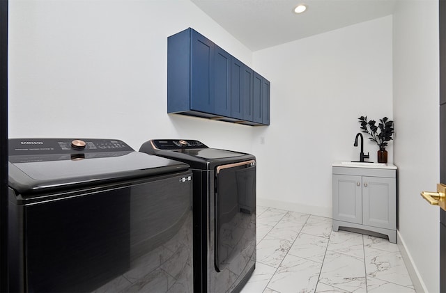 washroom with marble finish floor, independent washer and dryer, a sink, cabinet space, and baseboards