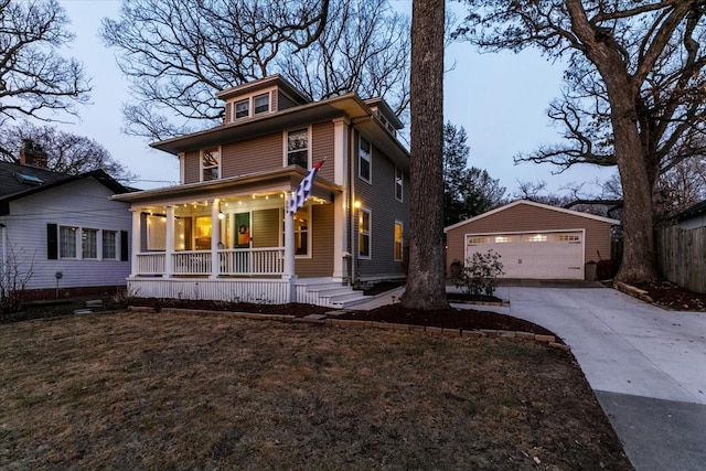 traditional style home featuring a garage, an outbuilding, and a porch