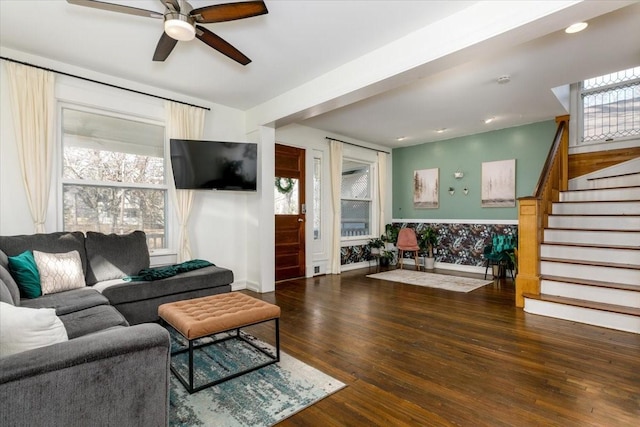 living room with stairway, baseboards, wood finished floors, and a ceiling fan