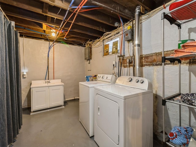 410 1st St S, Newton, IA 50208 - laundry room featuring laundry area, a sink, and separate washer and dryer