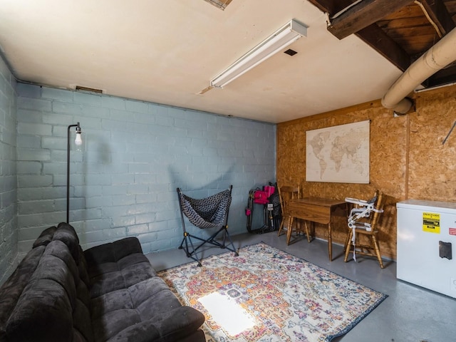 410 1st St S, Newton, IA 50208 - interior space with finished concrete flooring and concrete block wall