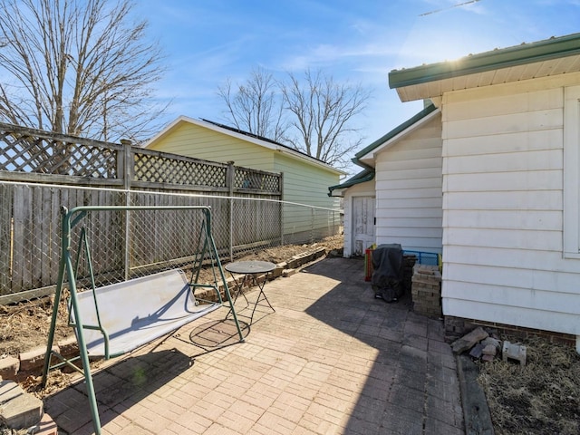 410 1st St S, Newton, IA 50208 - view of patio with a fenced backyard
