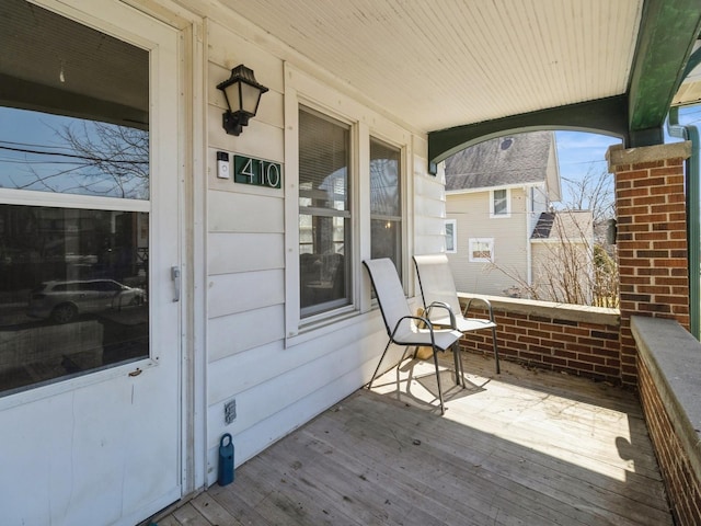 wooden deck featuring covered porch