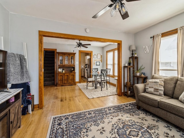 410 1st St S, Newton, IA 50208 - living area featuring ceiling fan, a wealth of natural light, and light wood finished floors