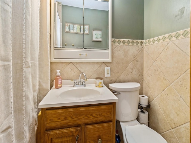 410 1st St S, Newton, IA 50208 - bathroom with toilet, tile walls, and vanity