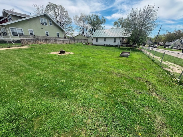 410 1st St S, Newton, IA 50208 - view of yard with a fenced backyard and a fire pit